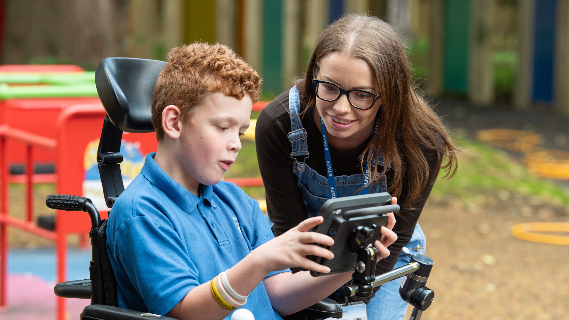 Student showing Therapist their Language Device